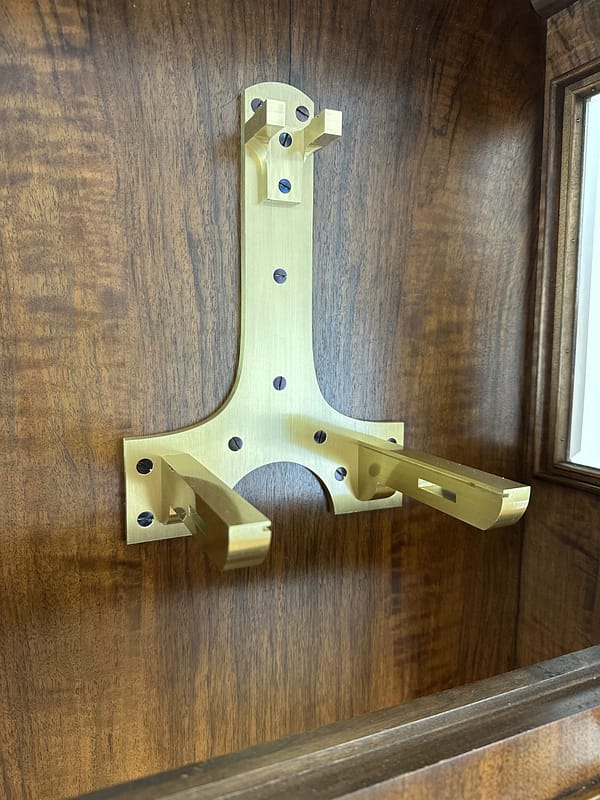 lenzkirch-regulator-longcase-precision-clock-movement-bracket image of a substantial cast brass movement securing bracket for a lenzkirch precision regulator clock