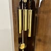 london-walnut-quarter-chiming-longcase-grandfather-clock-brass-weights A high quality, small proportioned, Westminster chiming longcase / grandfather clock by Maple of London. image showing three brass cased weights.