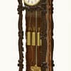 mayer-biedermeier-viennese-carved-grande-sonnerie-regulator-wall-clock-side-master Story antique clocks showroom image of the mahogany wall regulator clock made in Vienna circa 1850