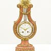 small-french-marble-lyre-mantel-clock-main-image Showroom image of the small french lyre shaped mantel clock