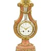 small-french-marble-lyre-mantel-clock A French Marble And Ormolu Mount Lyre Mystery Mantel Clock.