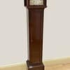 mahogany-westminster-chiming-grandmother-clock-side Imagre of a fine quality grandmother clock showing the silk lined fretted sides to the case.