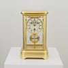 french-four-glass-year-duration-main showroom image of a superior quality, rare French gilt brass four-glass mantel timepiece, of one year duration dating to the late 19th century.