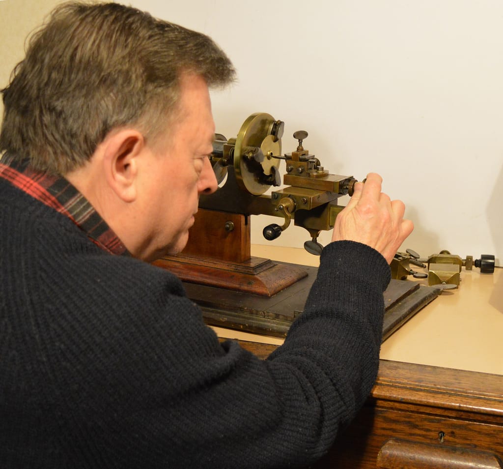 Horologist Kevin Dale FBHI working with a Swiss mandrel