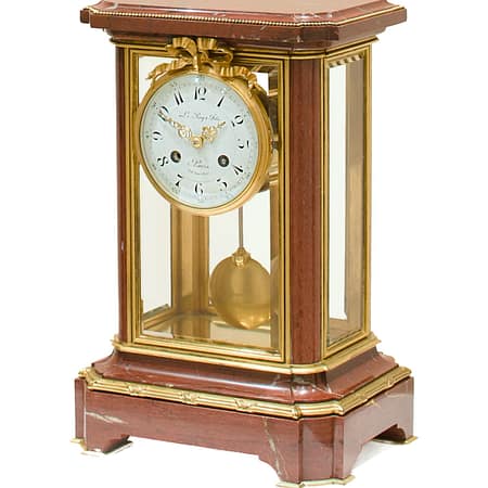 showroom image of a fine quality French rouge marble four-glass mantel clock by Le Roy & Fils, 13 - 15 Palais Royal Paris, Circa 1880.