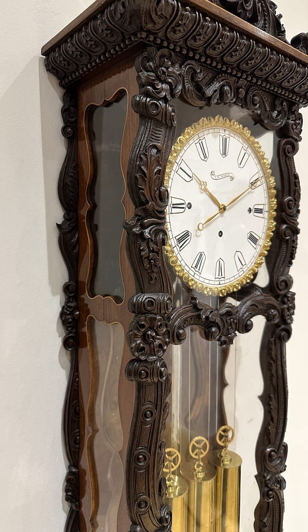 mayer-biedermeier-viennese-carved-grande-sonnerie-regulator-wall-clock-detail A side view image of the fine quality antique wall clock case and glazed sides
