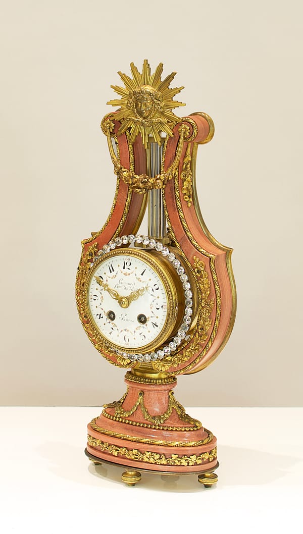 small-french-marble-lyre-mantel-clock-side-view A French Marble And Ormolu Mount Lyre Mystery Mantel Clock, angled view image