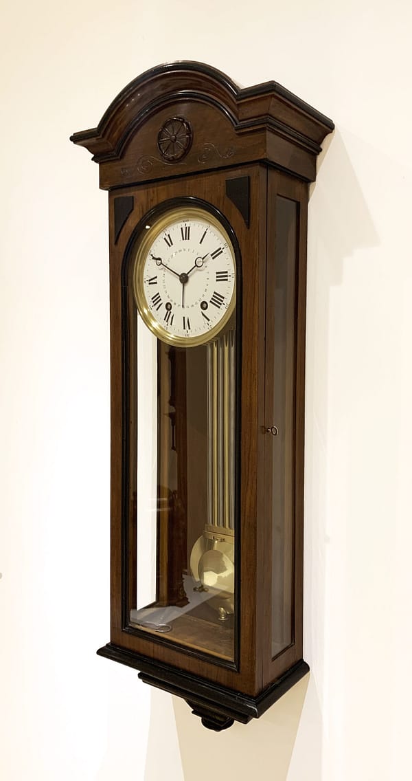 french-walnut-regulator-wall-clock-detail A side angle view of the elegant walnut french wall regulator clock