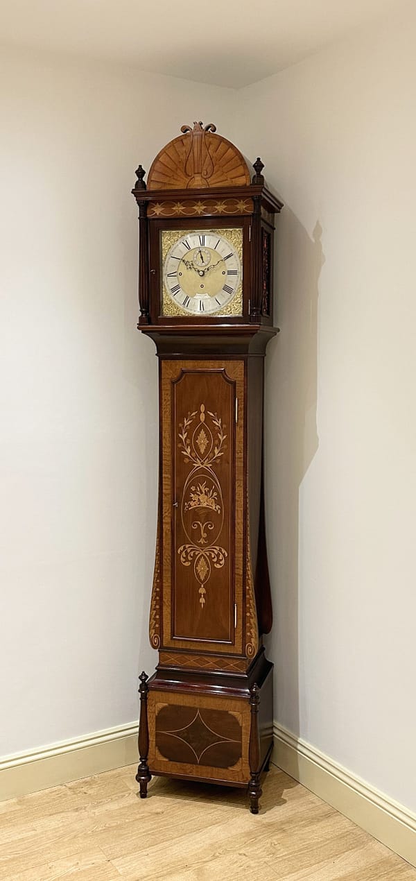 smith-london-quarter-chiming-longcase-clock-showroom A late victorian quarter chiming clock with a brass dial by smith of London