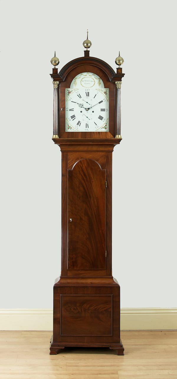 georgian-mahogany-longcase-antique-clock-painted-dial-master A fine quality flame mahogany 8 day longcase clock by John Startridge of Cowes c.1795 photographed in Story Antique Clocks showroom