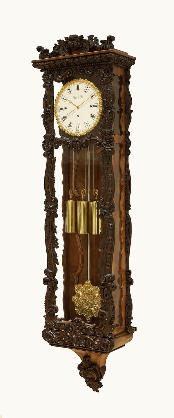 mayer-biedermeier-viennese-carved-grande-sonnerie-regulator-wall-clock-side-master Story antique clocks showroom image of the mahogany wall regulator clock made in Vienna circa 1850