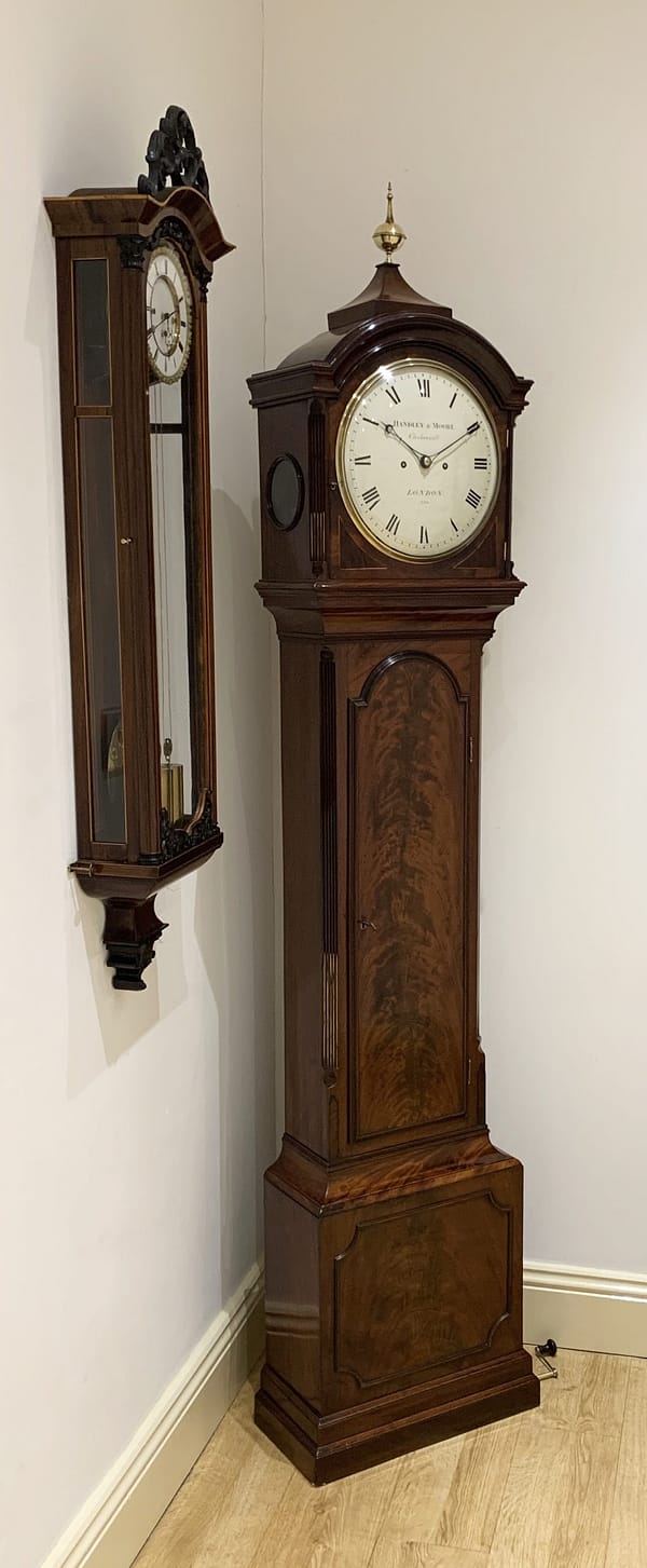 london-georgian-mahogany-longcase-grandfather-antique-clock-showroom-view A fine quality George III flame mahogany 8 day longcase clock by Handley & Moore of London circa 1800. showroom image.
