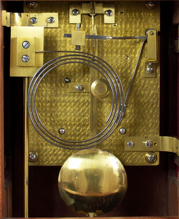 durden-london-mahogany-antique- bracket-clock-movement Detailed image of the decoration to the antique bracket clock backplate