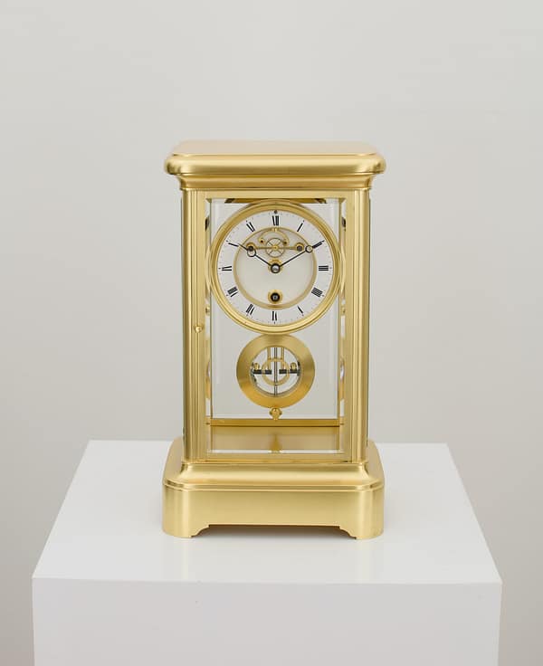 french-four-glass-year-duration-main showroom image of a superior quality, rare French gilt brass four-glass mantel timepiece, of one year duration dating to the late 19th century.