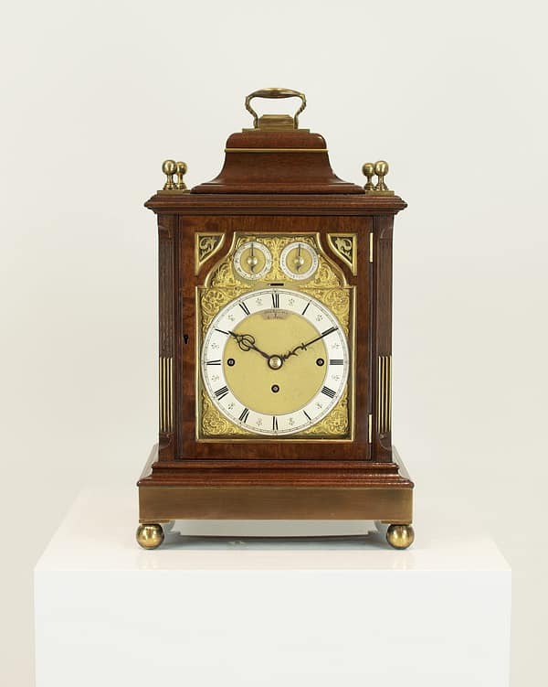 bull-bedford-quarter-chiming-mahogany-antique-bracket-clock-front-image image of the antique bracket clock in a ashowroom setting