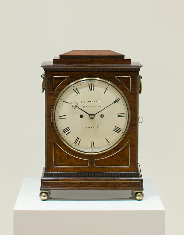 rosewood-bracket-clock-adams-london-master image of the fine quality regency rosewood bracket clock by Adams of london in a showrooom setting