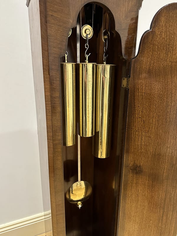 london-walnut-quarter-chiming-longcase-grandfather-clock-brass-weights A high quality, small proportioned, Westminster chiming longcase / grandfather clock by Maple of London. image showing three brass cased weights.