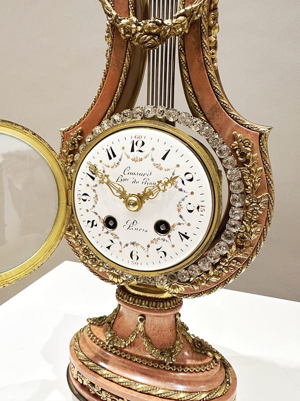 small-french-marble-lyre-mantel-clock-dial Image of the convex enamel dial with floral swags and roman numerals