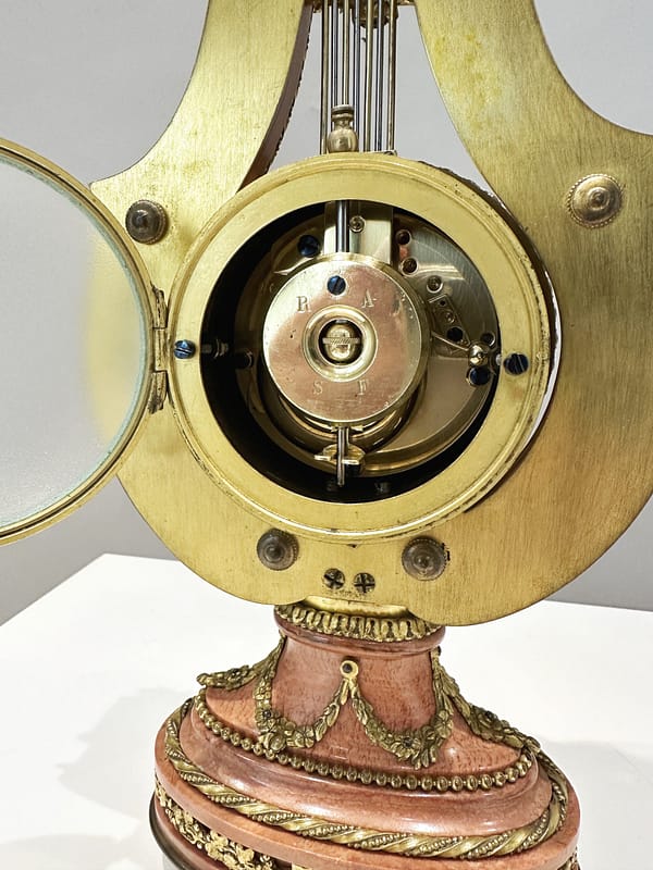small-french-marble-lyre-mantel-clock-movement Image of the fully restored 8 day movement