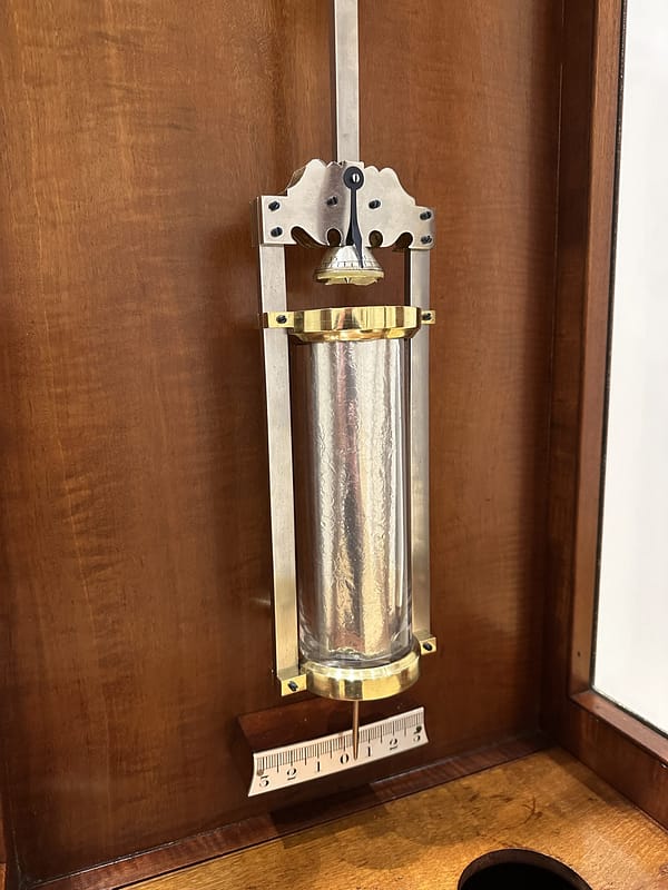 victorian-mahogany-floorstanding-regulator-longcase -clock-pendulum image of the glass jar mercury compensated pendulum for an english floor standing regulator longcase clock.