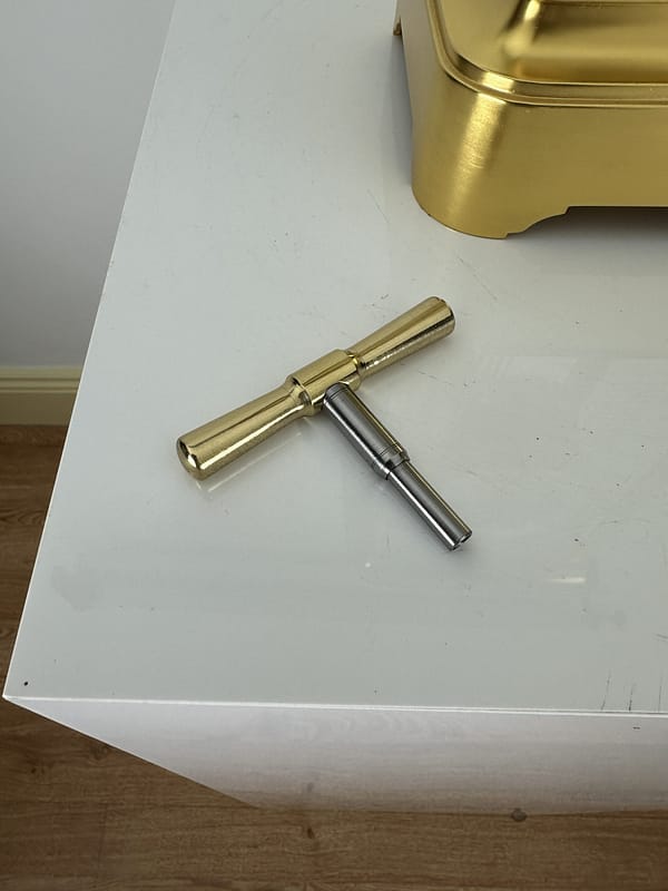 french-four-glass-year-duration-winding-key detailed image of a superior quality, rare French gilt brass four-glass mantel timepiece, of one year duration dating to the late 19th century enamelled dial with visible brocot escapement