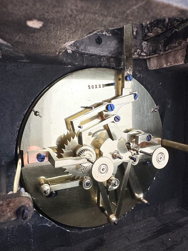 french-perpetual-calendar-mantel-clock-movement-detail image of the complex perpetual clock movement.