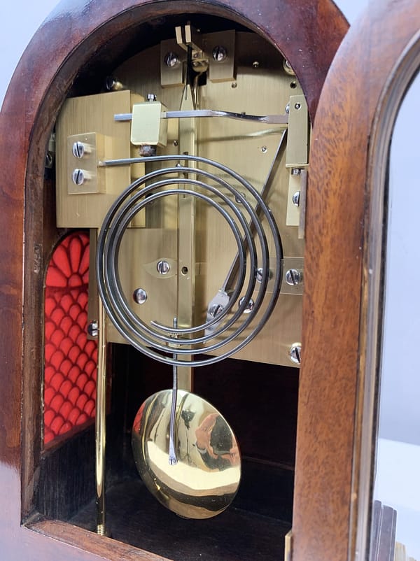durden-london-mahogany-fusee-mantel-clock-movement An image of the beautifully restored and polished antique clock movement by Durden and showing detail of the brass bob pendulum.