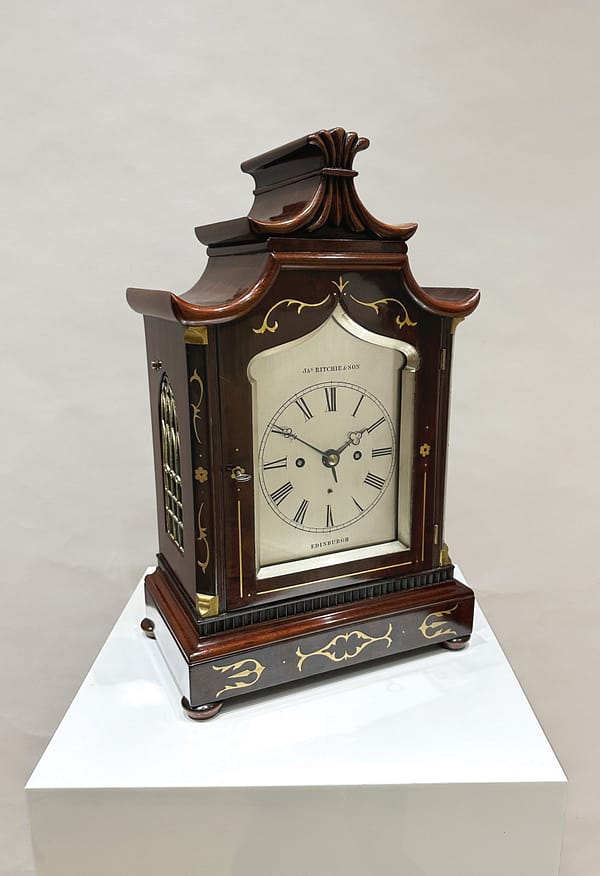 ritchie-edinburgh-mahogany-regency-fusee-bracket-clock-side Image of the clock taken from the side showing the sound frets