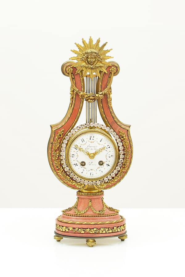 small-french-marble-lyre-mantel-clock-main-image Showroom image of the small french lyre shaped mantel clock