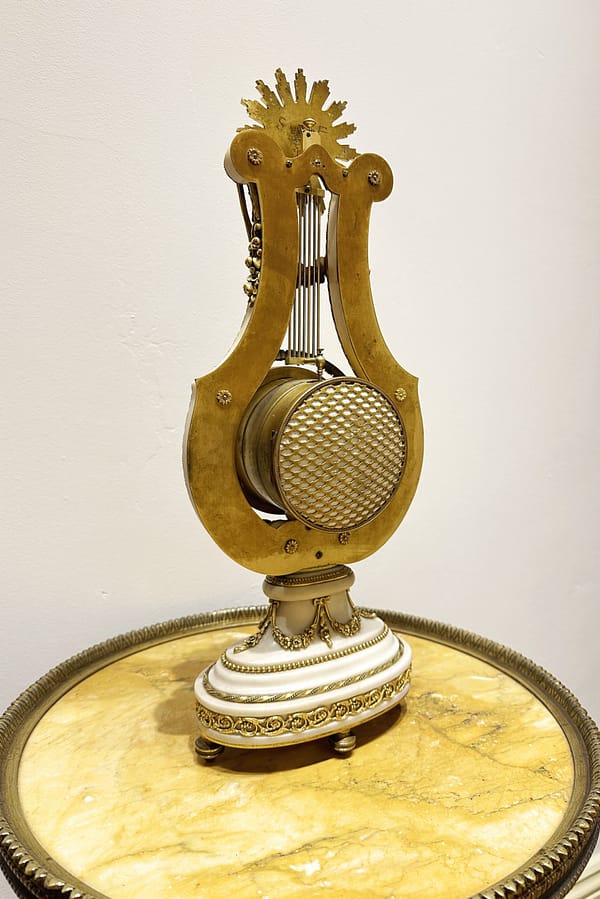 french-white-marble-lyre-mantel-clock-back a rear view image of the antique lyre mantel clock