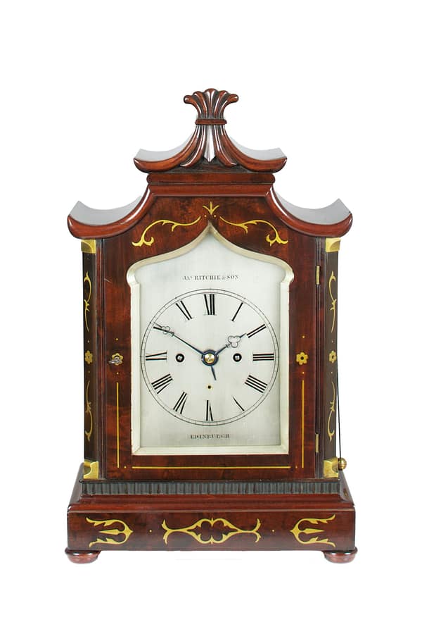 ritchie-edinburgh-mahogany-regency-fusee-bracket-clock A high quality 8 day mahogany and brass inlaid bracket clock, by James Ritchie & Son, Edinburgh c.1837 ( William IV) striking the hours on a single bell with additional alarm feature. The clock also has a mahogany wall bracket so the clock can be wall mounted if desired.