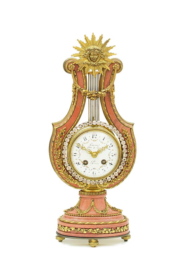 small-french-marble-lyre-mantel-clock A French Marble And Ormolu Mount Lyre Mystery Mantel Clock.