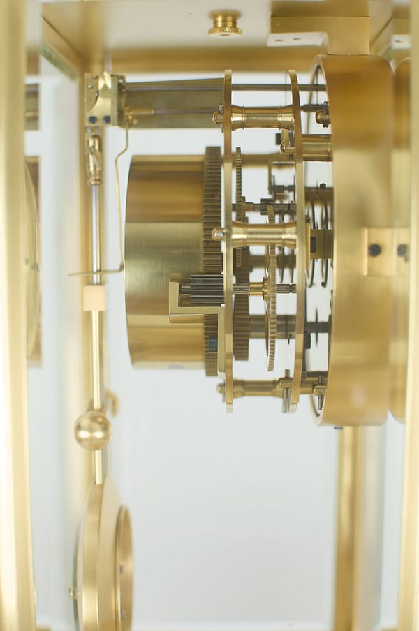 french-four-glass-year-duration-movement-side close up image of a fully restored movement of a superior quality, rare French gilt brass four-glass mantel timepiece, of one year duration dating to the late 19th century.