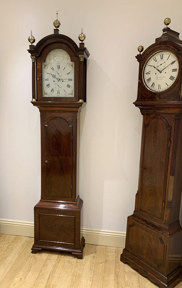 georgian-mahogany-longcase-antique-clock-painted-dial-showroom A fine quality flame mahogany 8 day longcase clock by John Startridge of Cowes c.1795 photographed in Story Antique Clocks showroom.